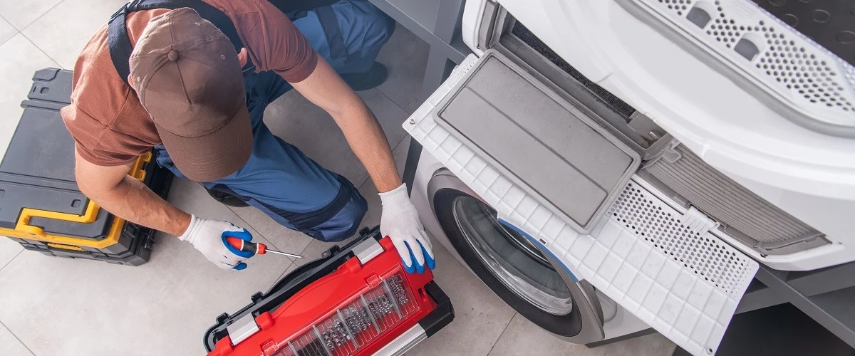 Contractor installing appliances on house