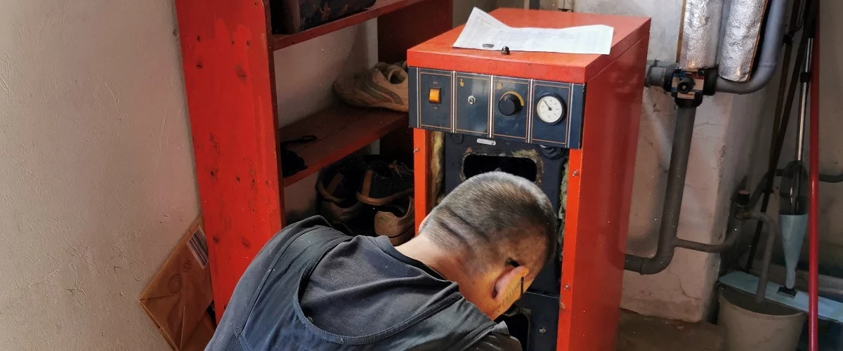 Contractor cleaning the chimney