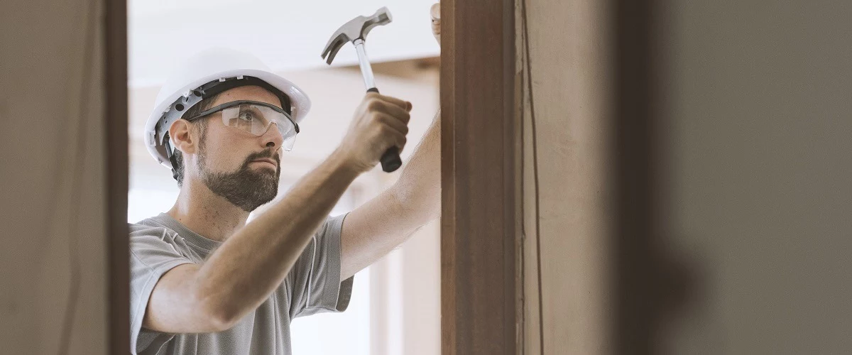 Contractor installing door