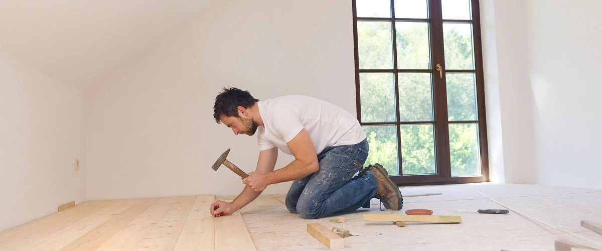 Contractor installing wood floorings