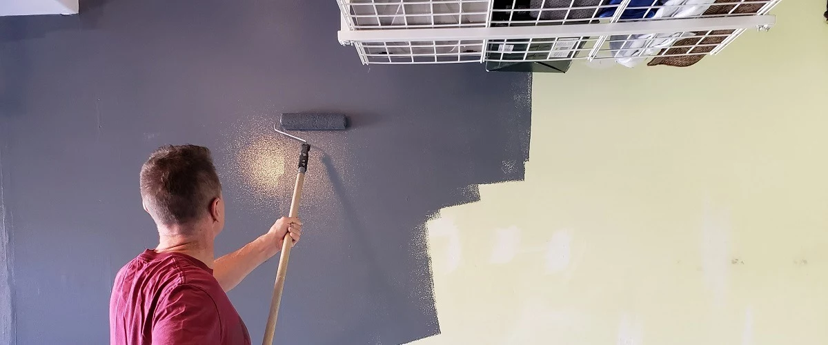 Contractor painting a wall