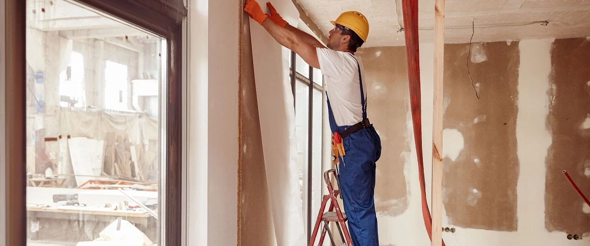 Contractor covers walls with decorative paper