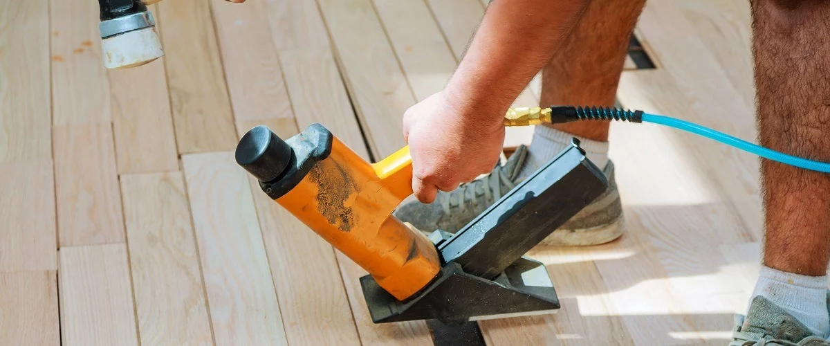 Contractor installing wood floorings